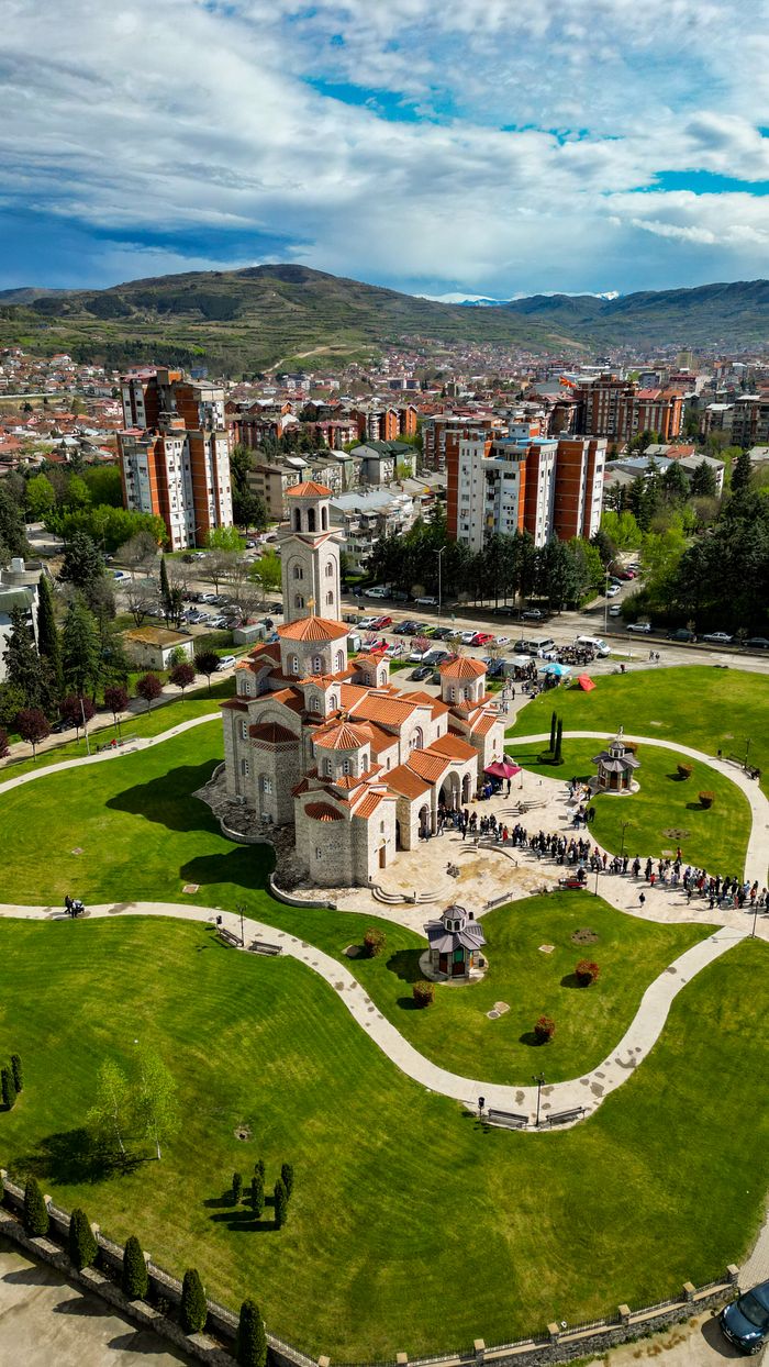 Stunning aerial view of Saint Petka Church in Kavadarci, showcasing urban architecture and lush greenery.