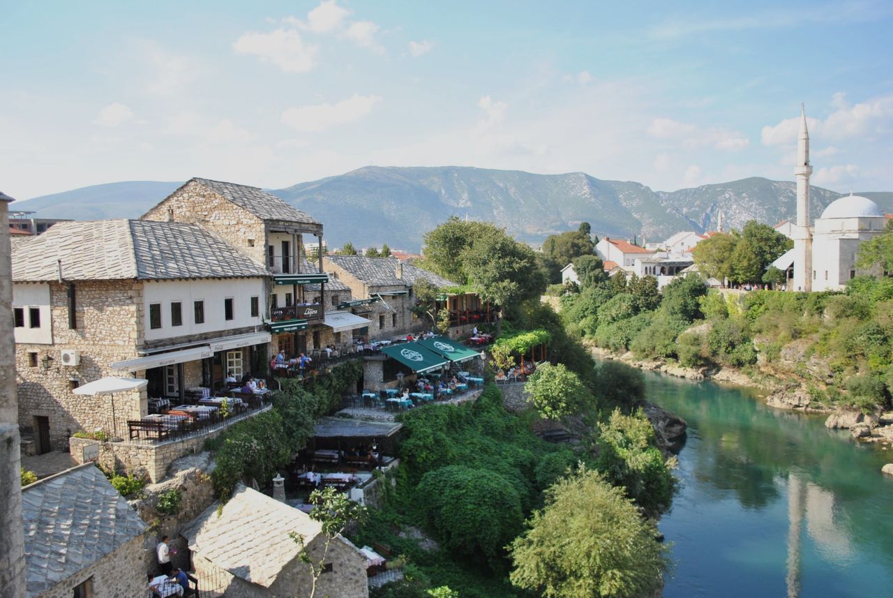 Scenic view of traditional stone houses and Neretva river in Mostar, Bosnia.